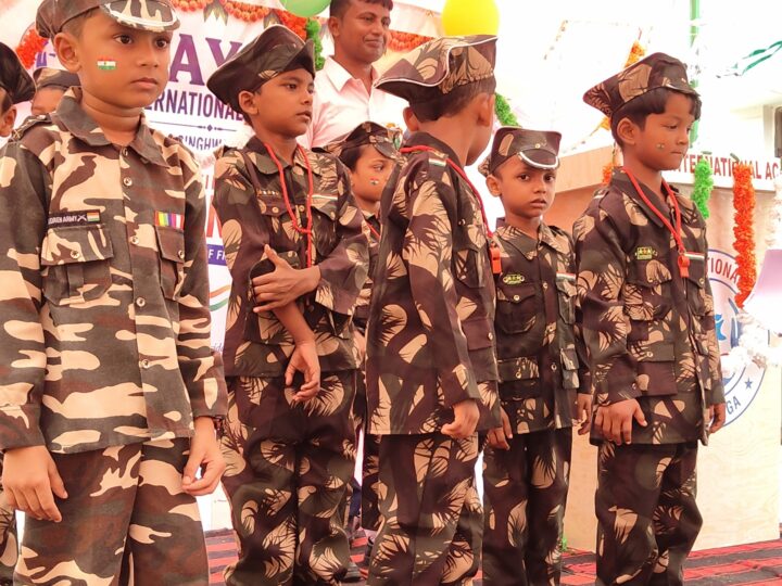 Children in army costumes performing on Independence Day