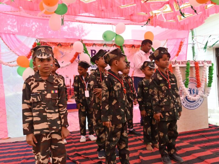 Children in army costumes performing on Independence Day