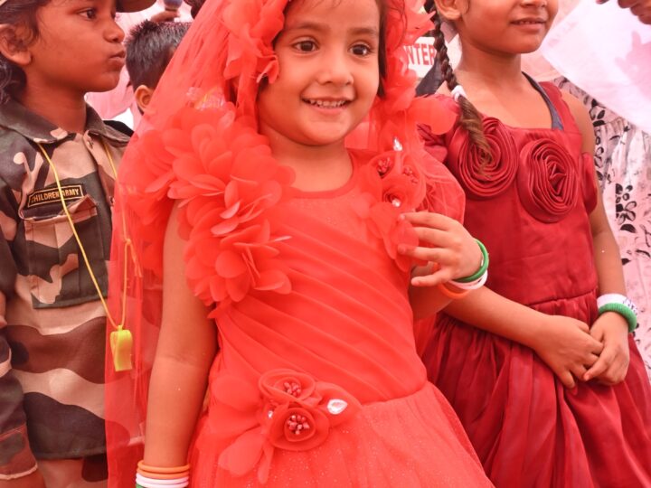 Girl in a red dress at the Independence Day programme