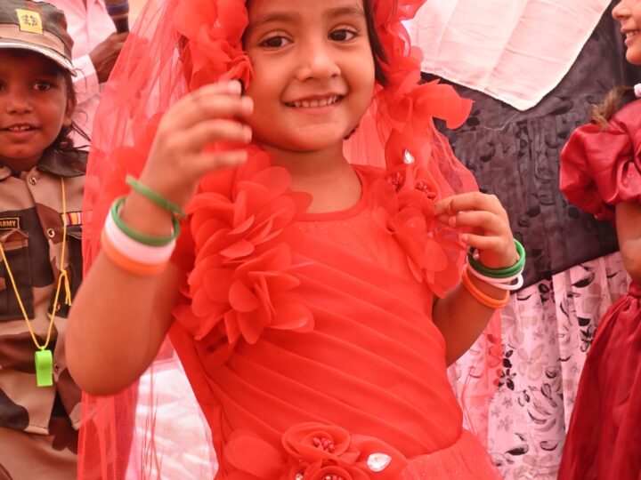 Girl in a red dress at the Independence Day programme