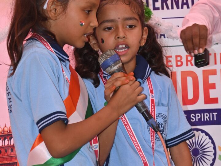 Two girls singing on stage on Independence Day