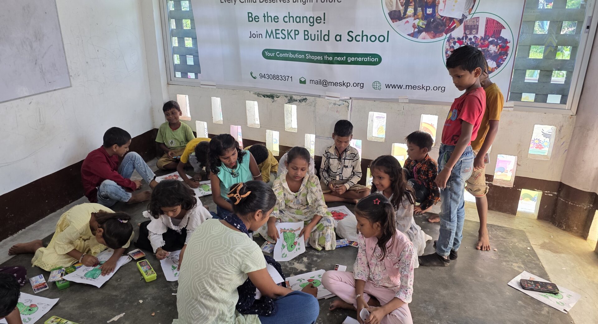 Contact 1 Children and volunteers on drawing day, wide view
