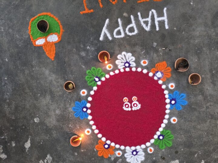 Finished rangoli with lit diyas