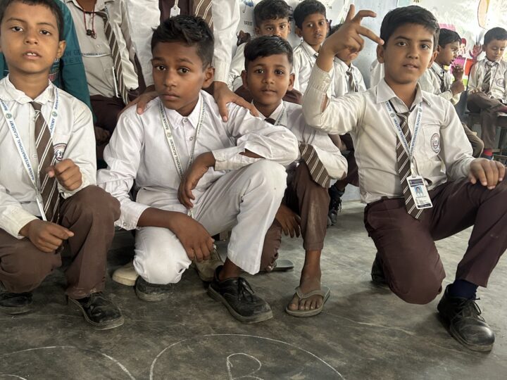 Students in uniform sitting together in class