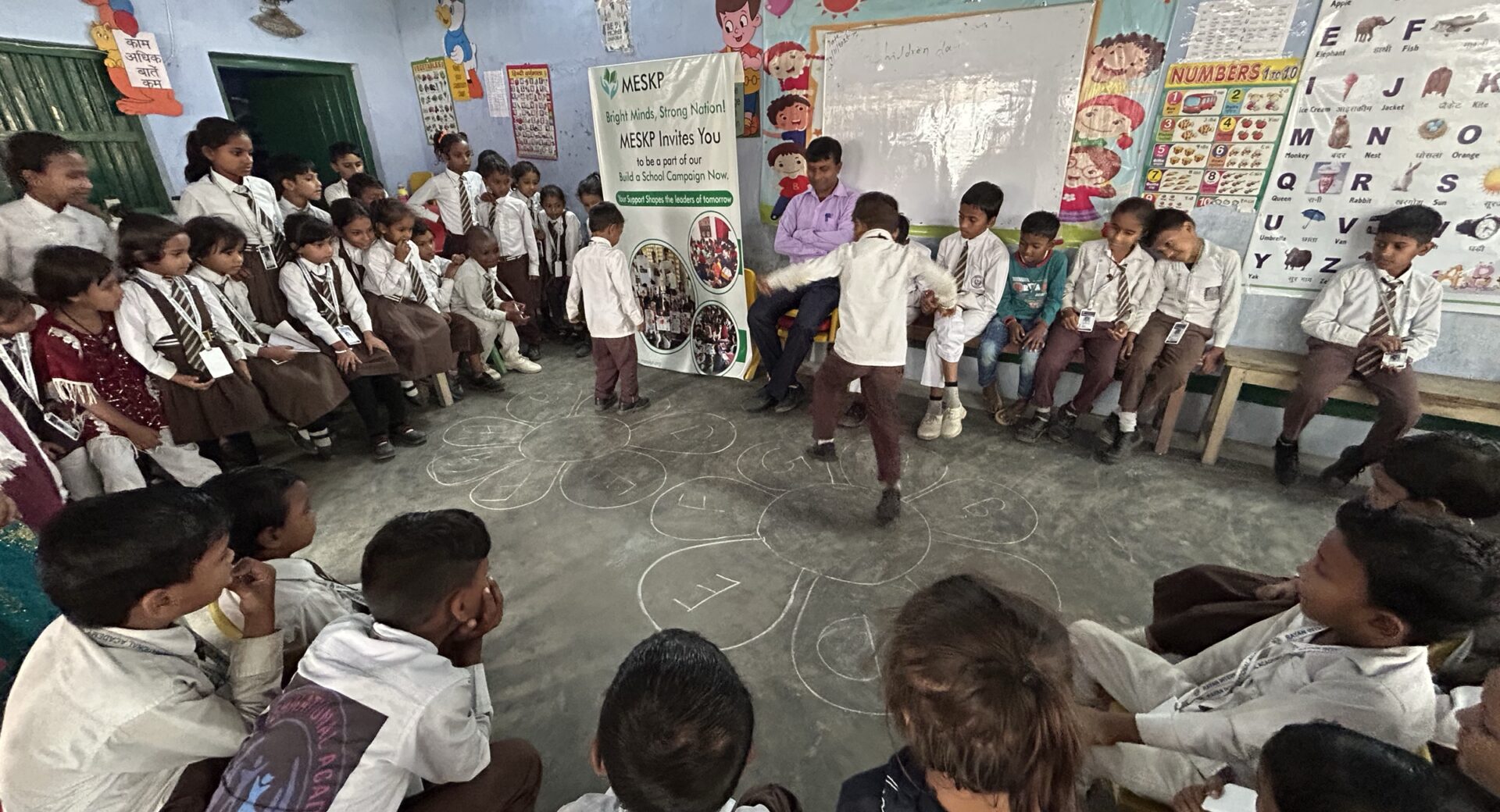 FAQ 1 Students playing a circle game in class