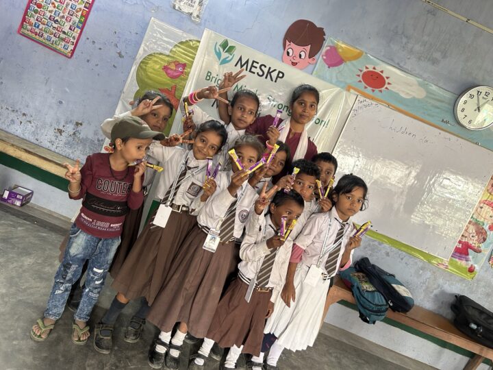 Girls in uniform celebrating prize day