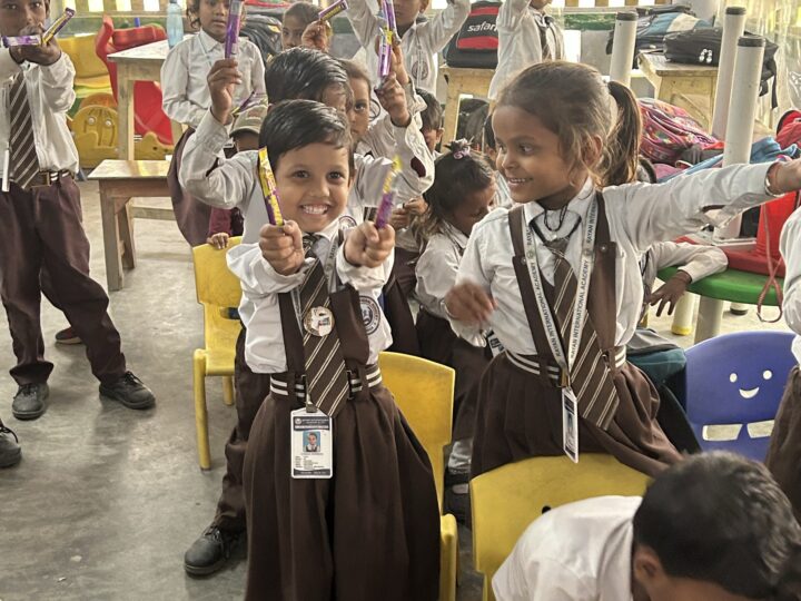 Girls in uniform with their treats on prize day