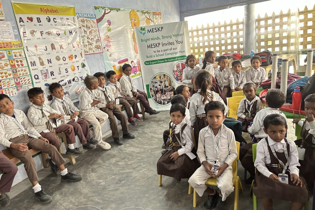 Uniformed pre-primary class seated in a circle at the Kathalia campus
