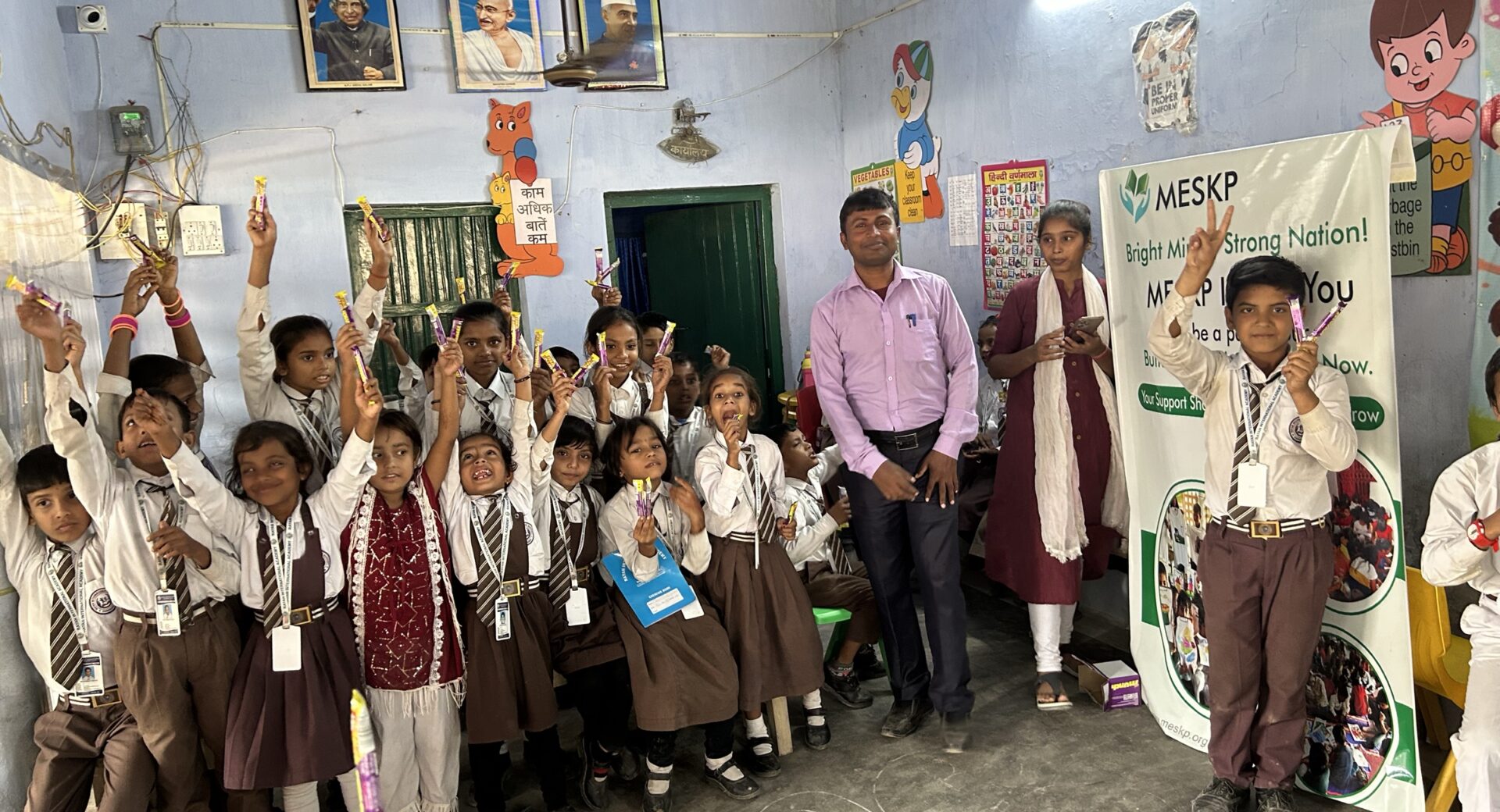 Students cheering in class on prize day at the Kathalia campus