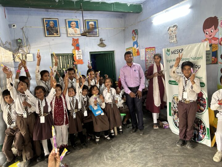 Students cheering in class on prize day at the Kathalia campus