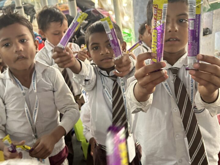 Students showing their prizes