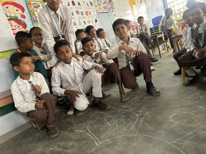 Home 10 Students sitting in a row in class