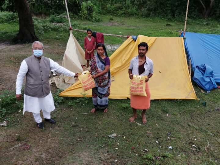 Volunteers distributing relief kits to families with social distancing during the COVID-19 lockdown