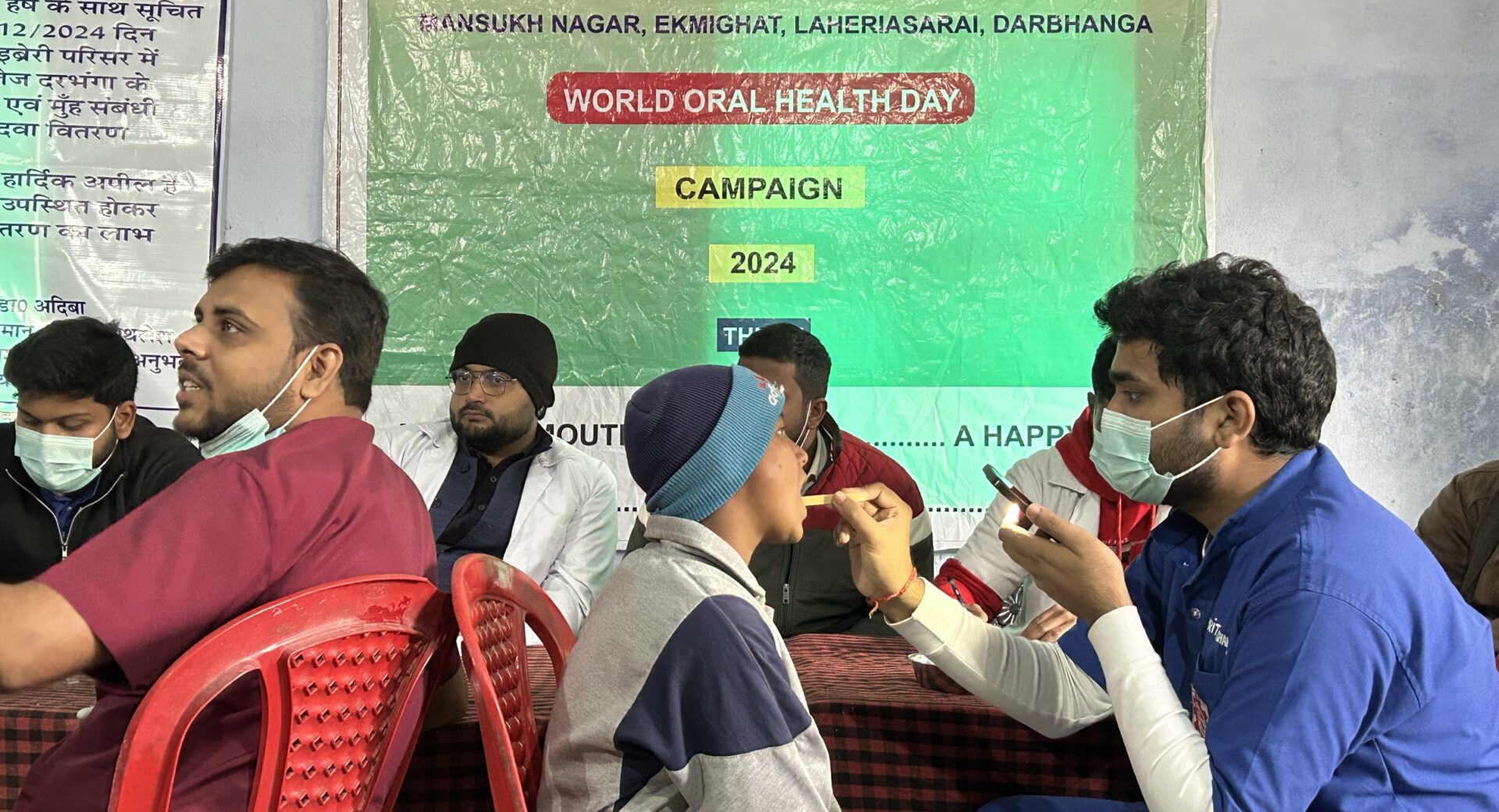 Dentist examining a patient at the free dental screening camp, Darbhanga, December 2024