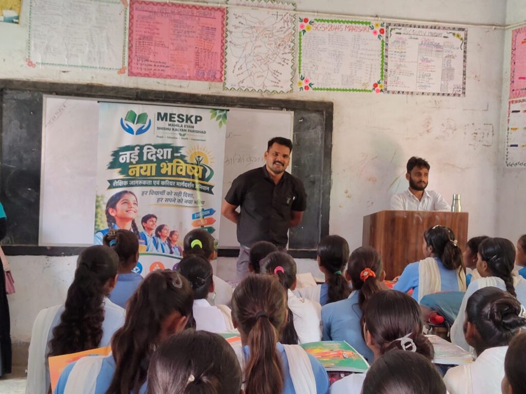 Girls in a classroom listen to a Nai Disha speaker