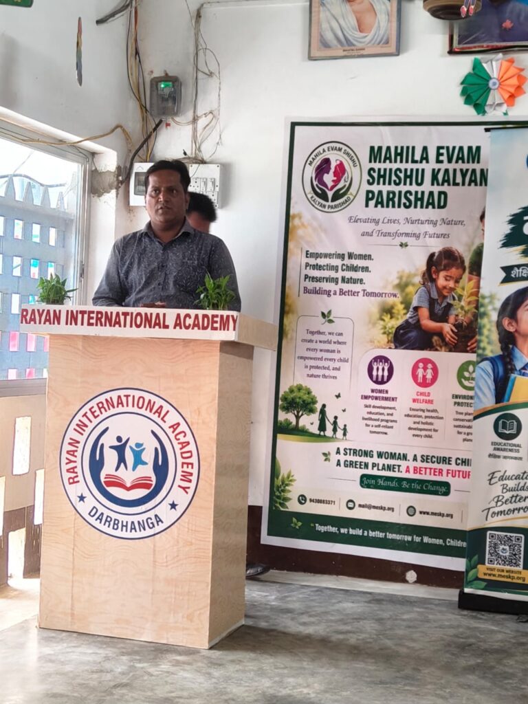 A speaker at the podium during a Nai Disha session