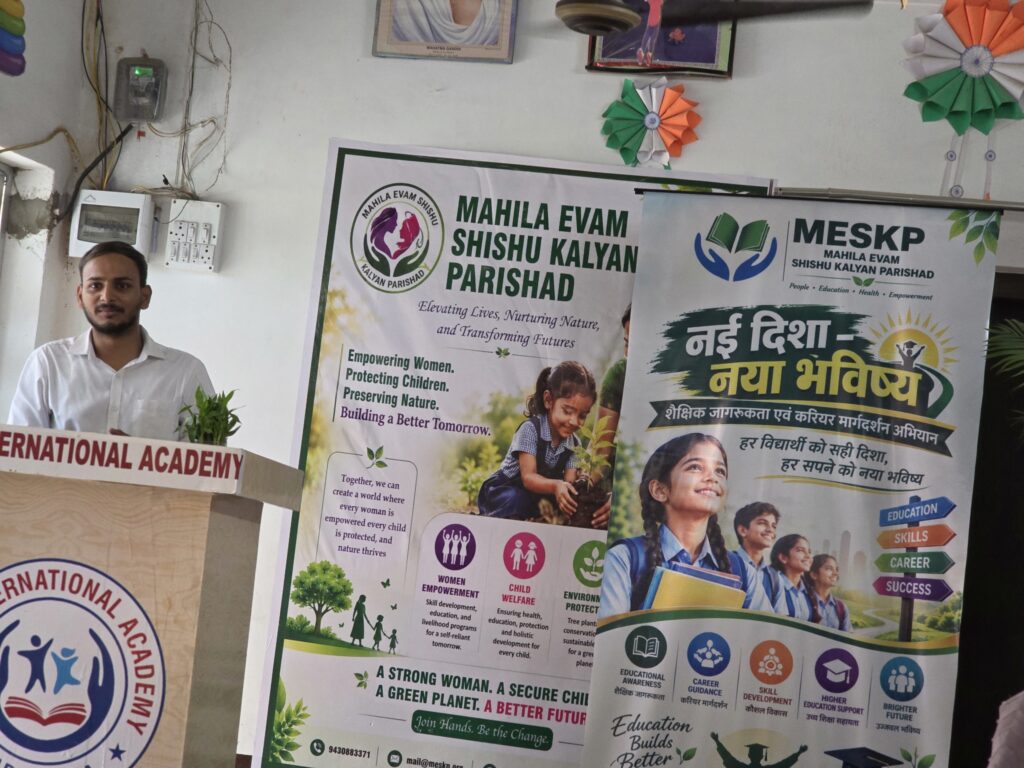 A speaker at a Nai Disha session beside the campaign banner
