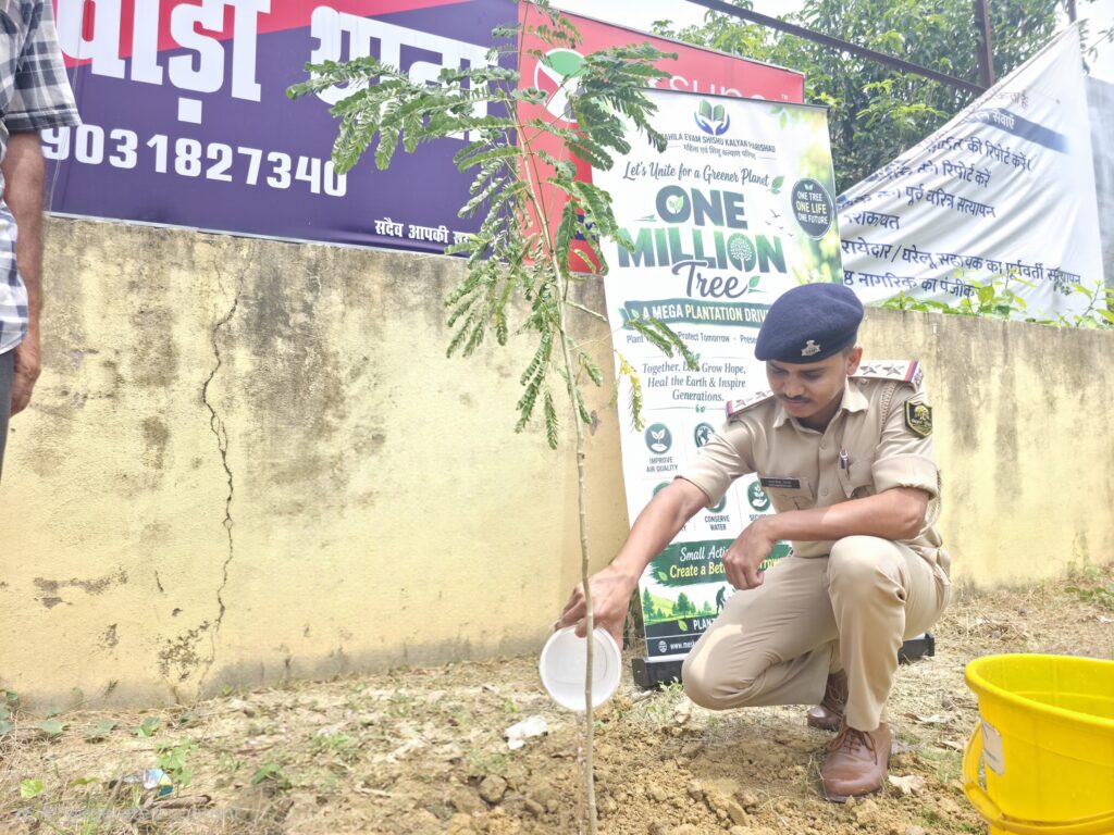 50 fruit and shade trees planted at Singhwara police station 9 A police officer waters a sapling he has just planted