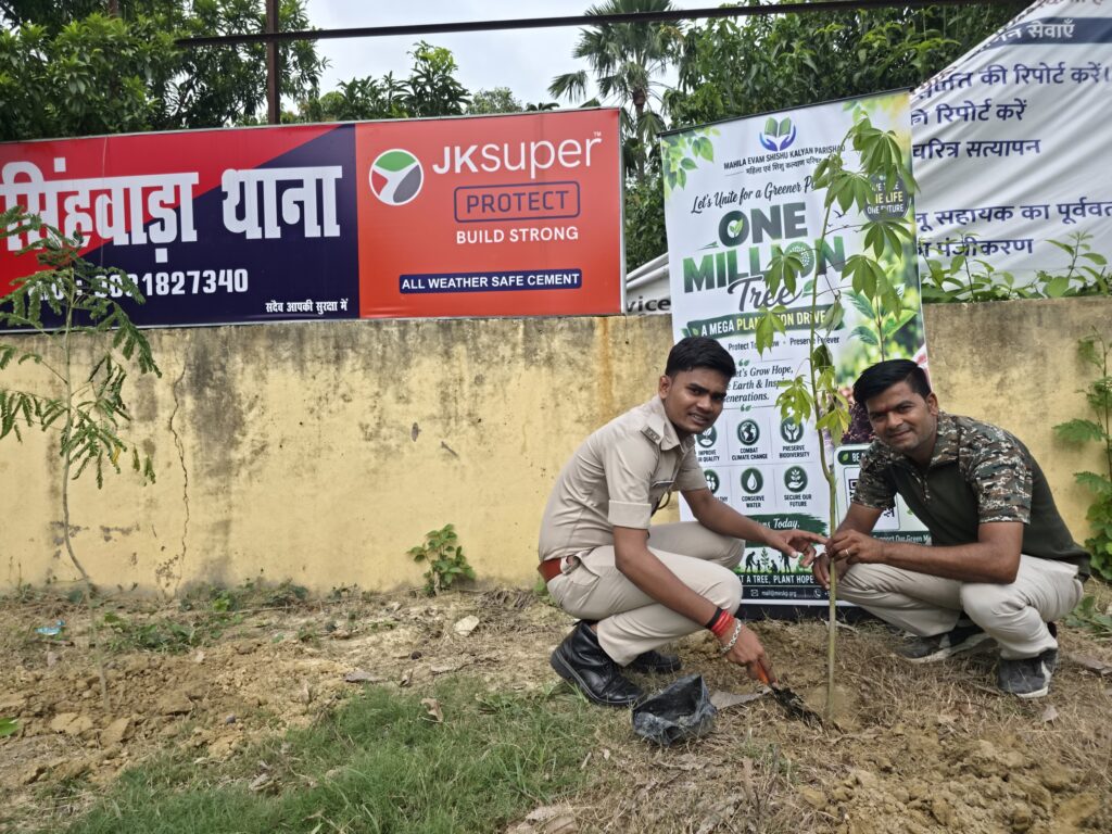 50 fruit and shade trees planted at Singhwara police station 5 A police officer and a volunteer plant a sapling