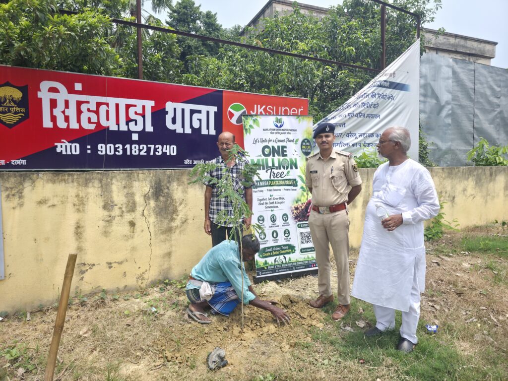 50 fruit and shade trees planted at Singhwara police station 4 A sapling being planted at Singhwara police station with officers and MESKP members
