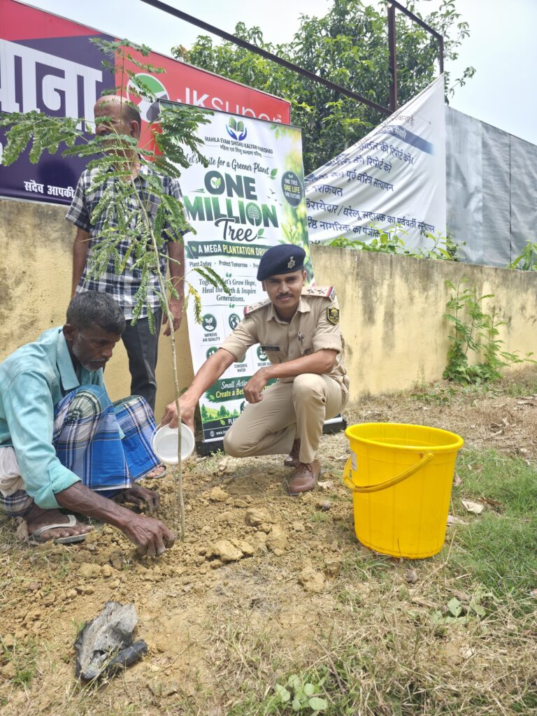 50 fruit and shade trees planted at Singhwara police station 7 A villager waters a newly planted sapling as an officer looks on