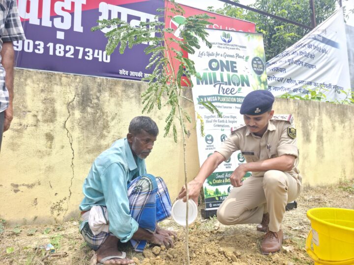 Gift a Tree 4 A police officer and a villager water a newly planted sapling