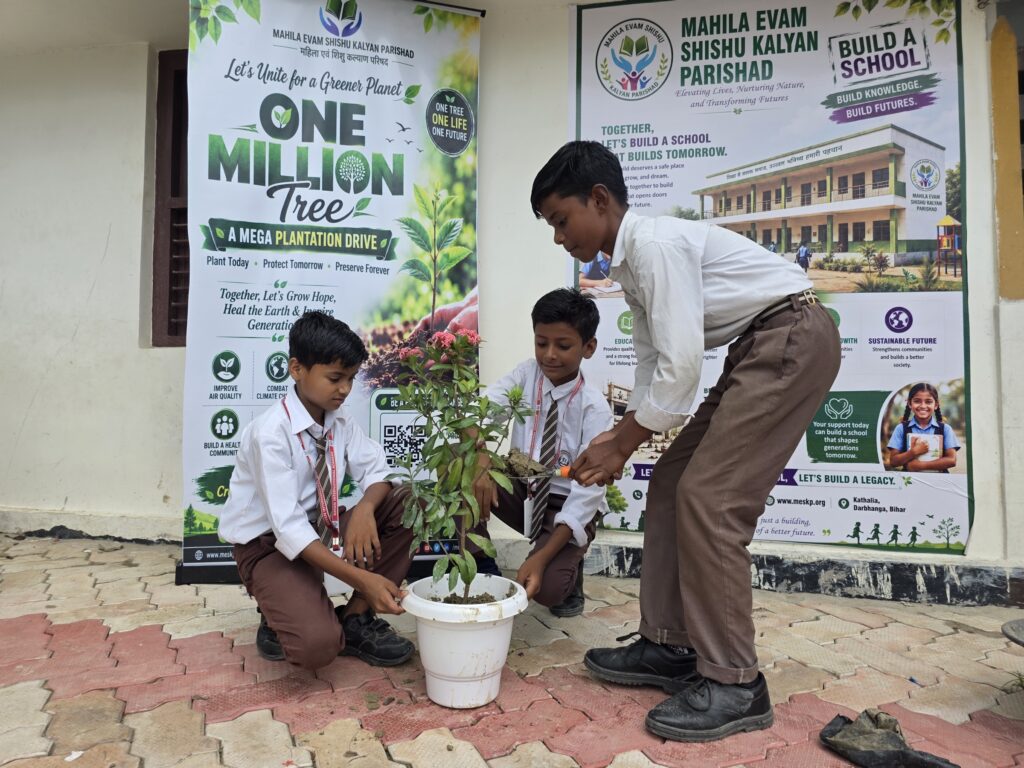 Students potting saplings in front of the One Million Trees banner
