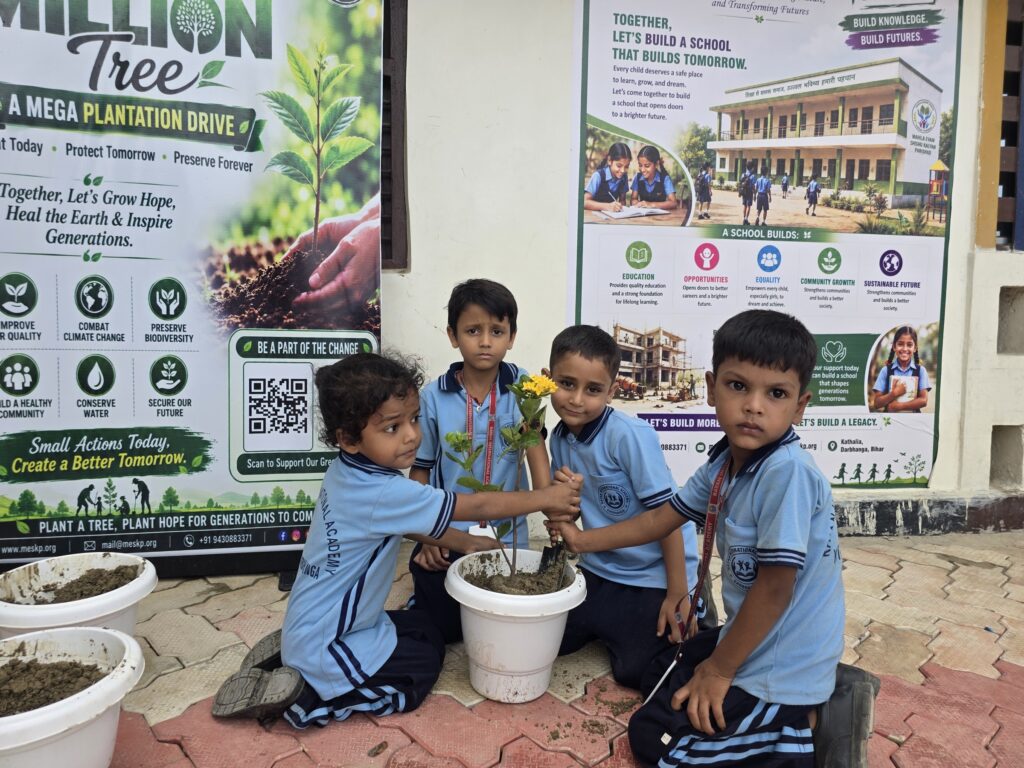 Students potting saplings in front of the One Million Trees banner